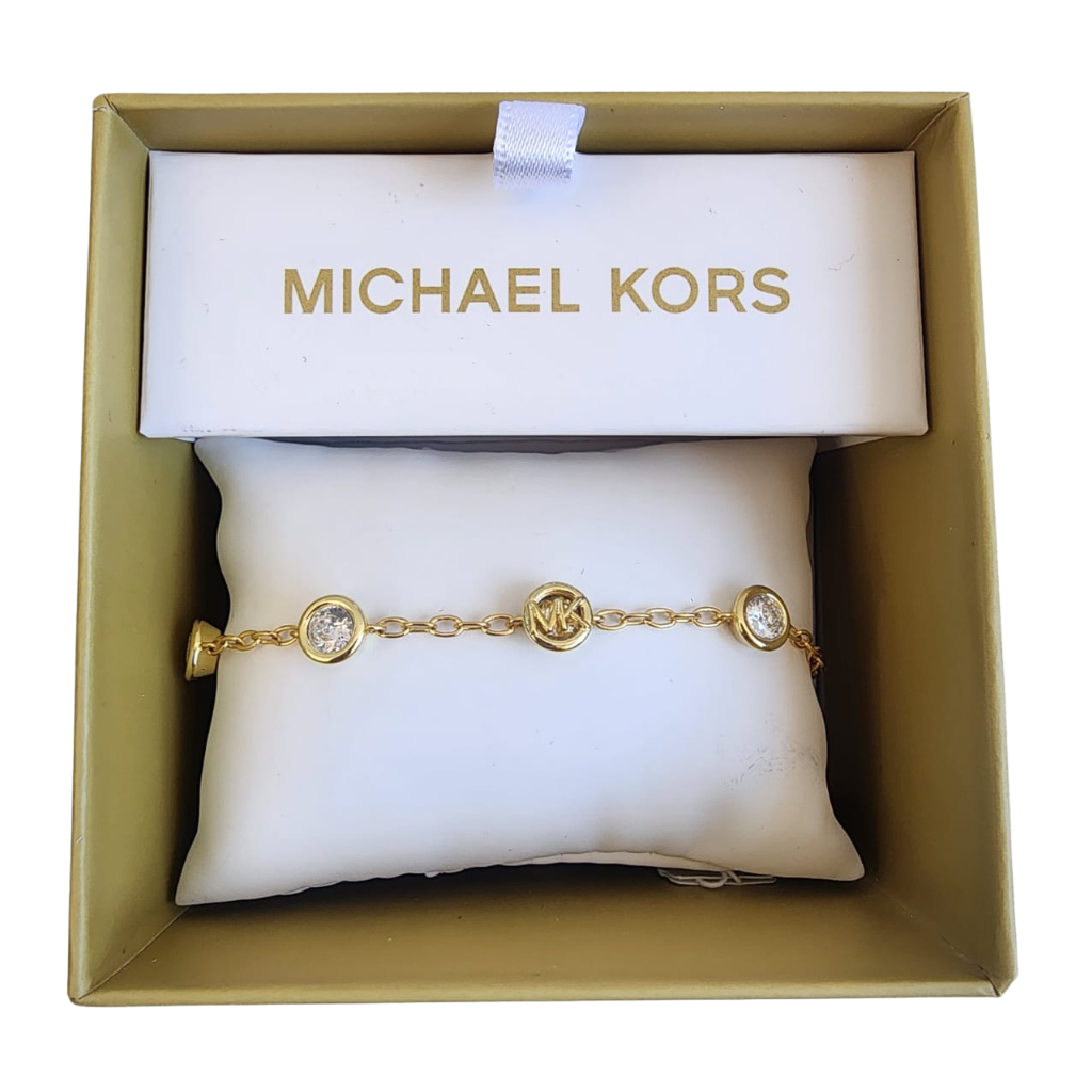Pulsera Michael Kors dorada con dijes y cristales elegantes