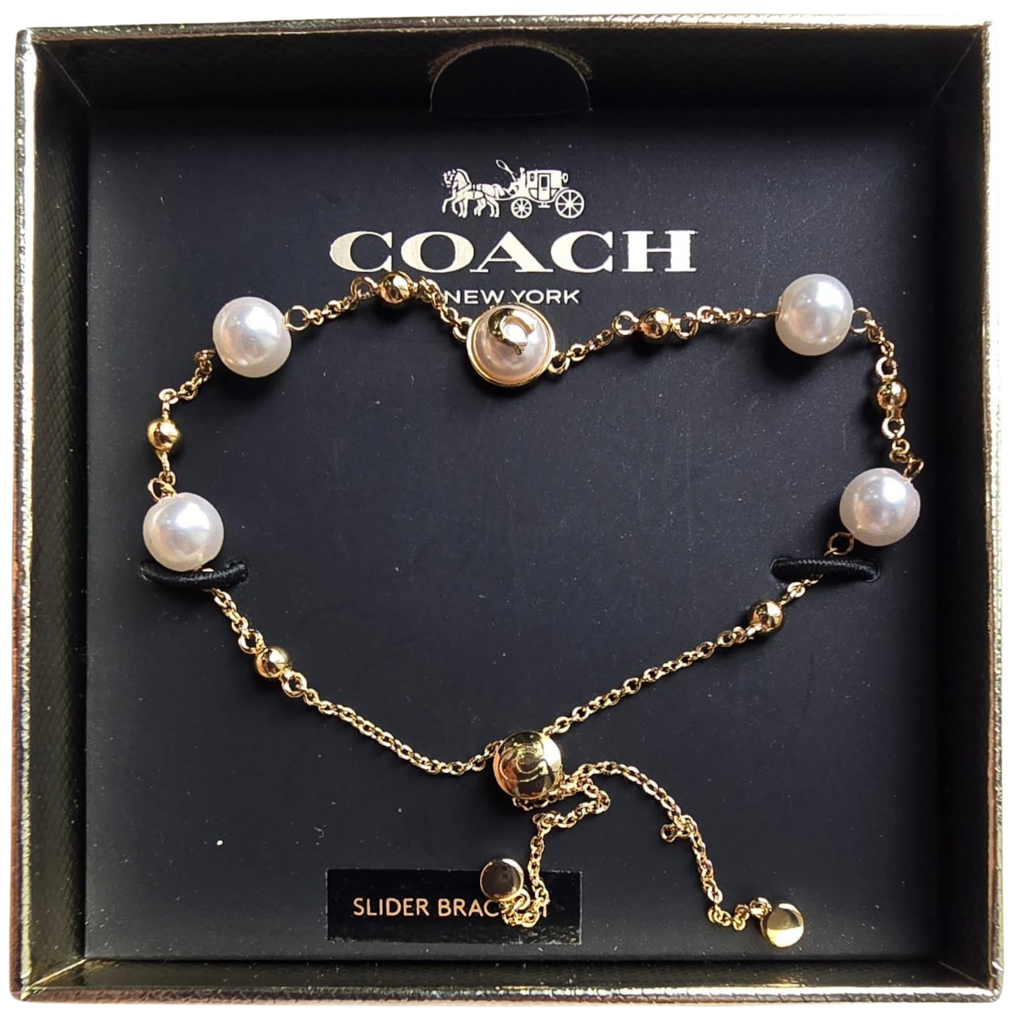Pulsera Coach Dorada con Perlas Ajustable y Elegante