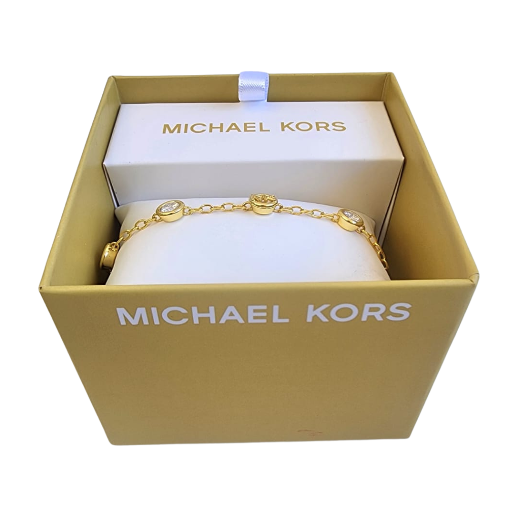 Pulsera Michael Kors dorada con dijes y cristales elegantes