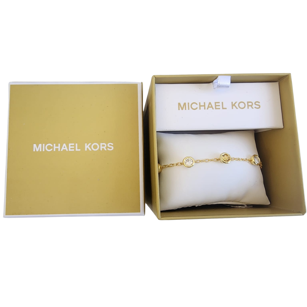 Pulsera Michael Kors dorada con dijes y cristales elegantes