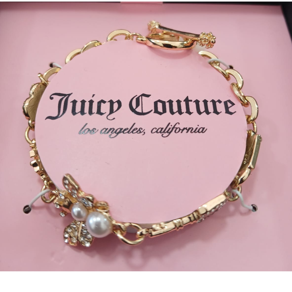 Pulsera Juicy Couture dorada con dije mariposa y perla