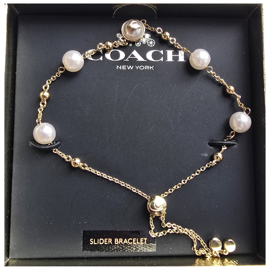 Pulsera Coach Dorada con Perlas Ajustable y Elegante