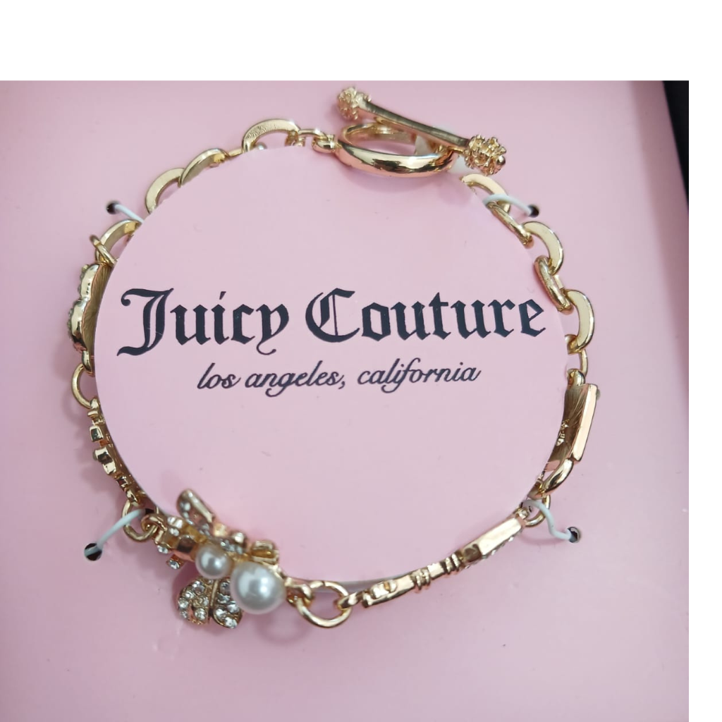 Pulsera Juicy Couture dorada con dije mariposa y perla