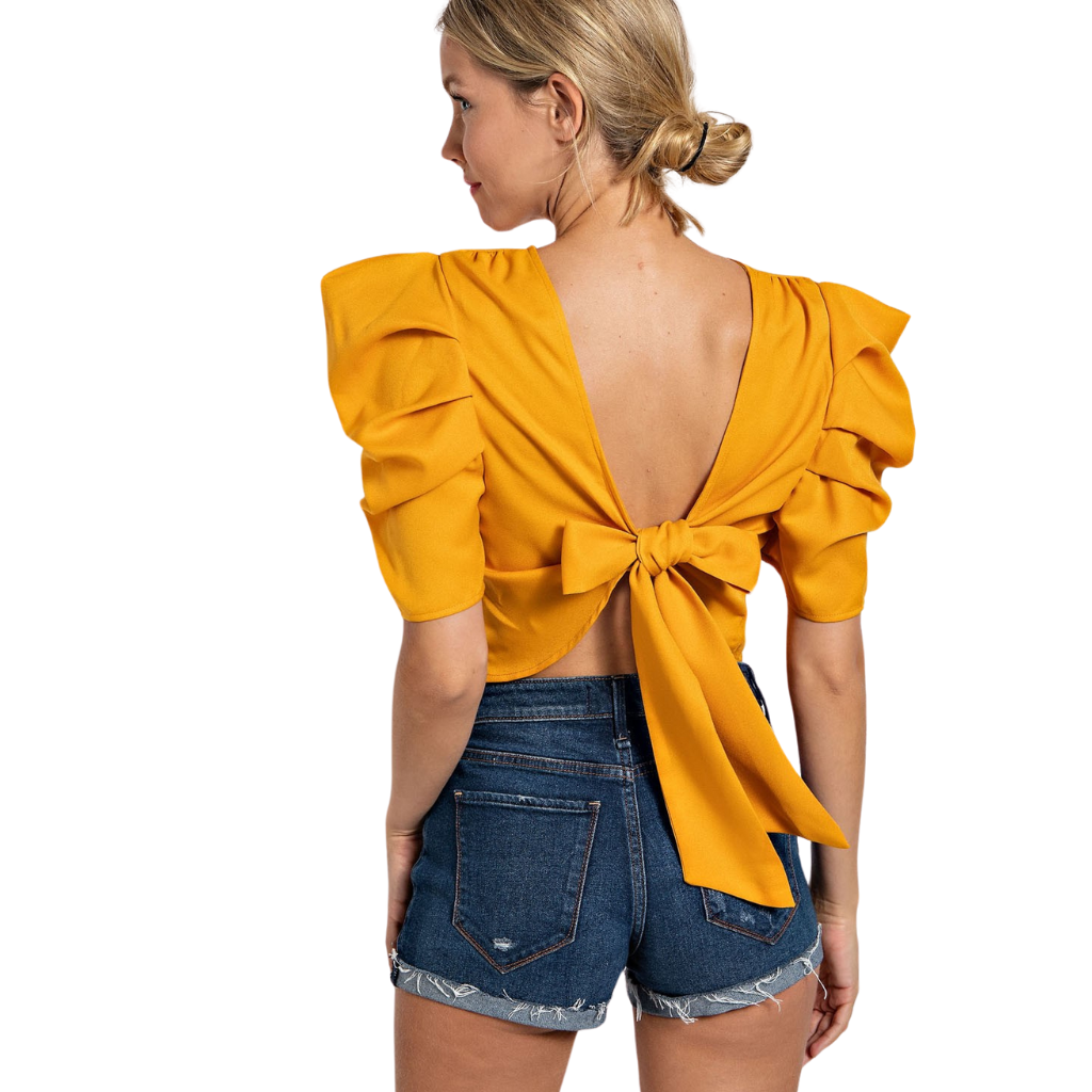 Crop top mostaza con mangas abullonadas y moño en espalda